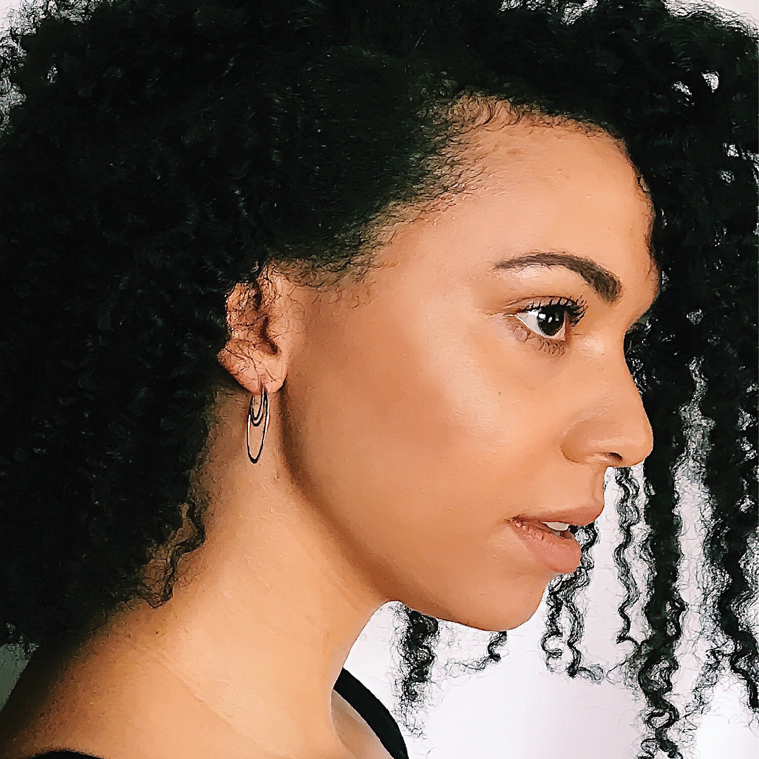 AELLA // greek amazon warrior two-tone hoop earrings  on model