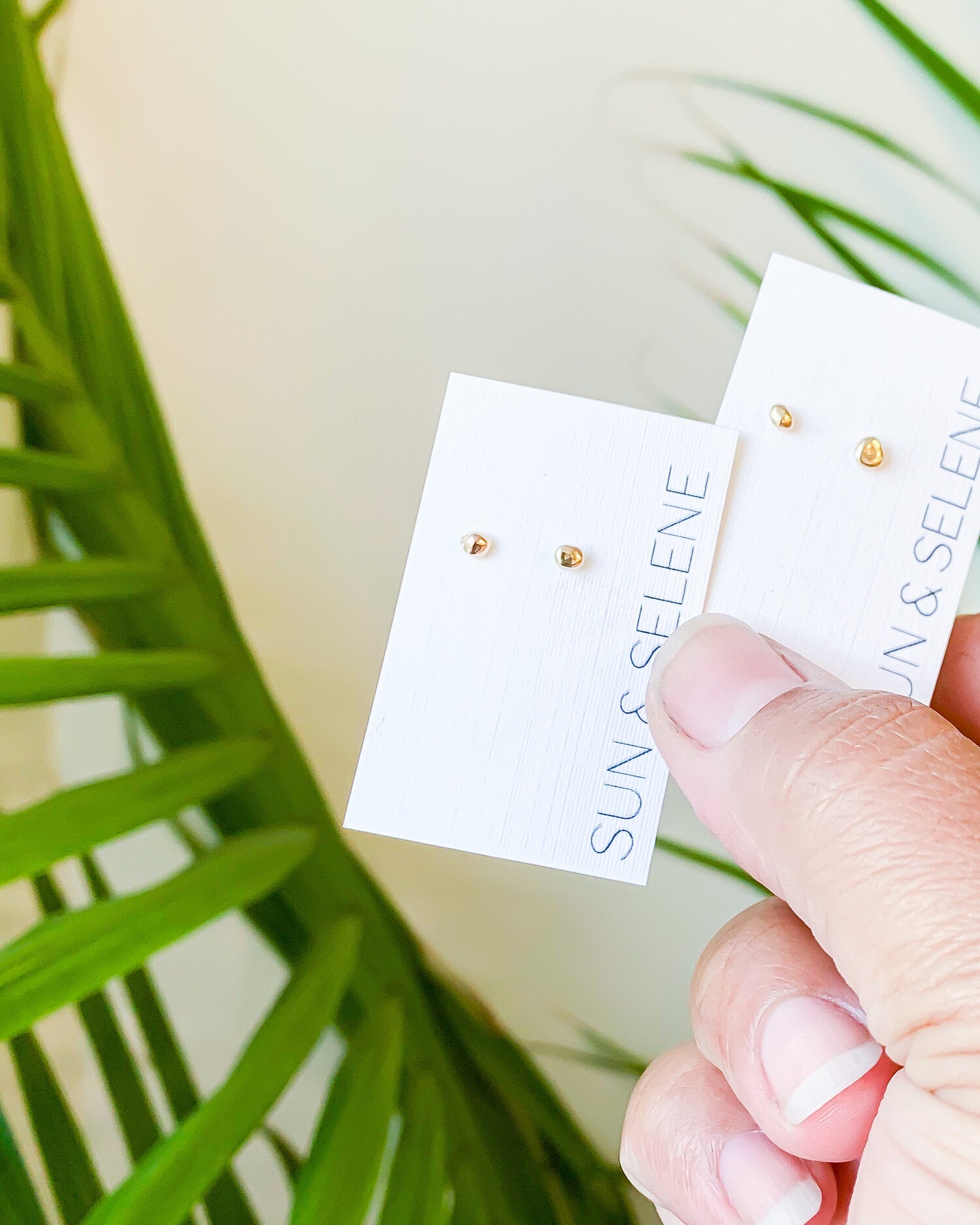 SUN & SELENE earrings on card