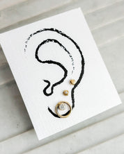 SUN & SELENE earrings on card