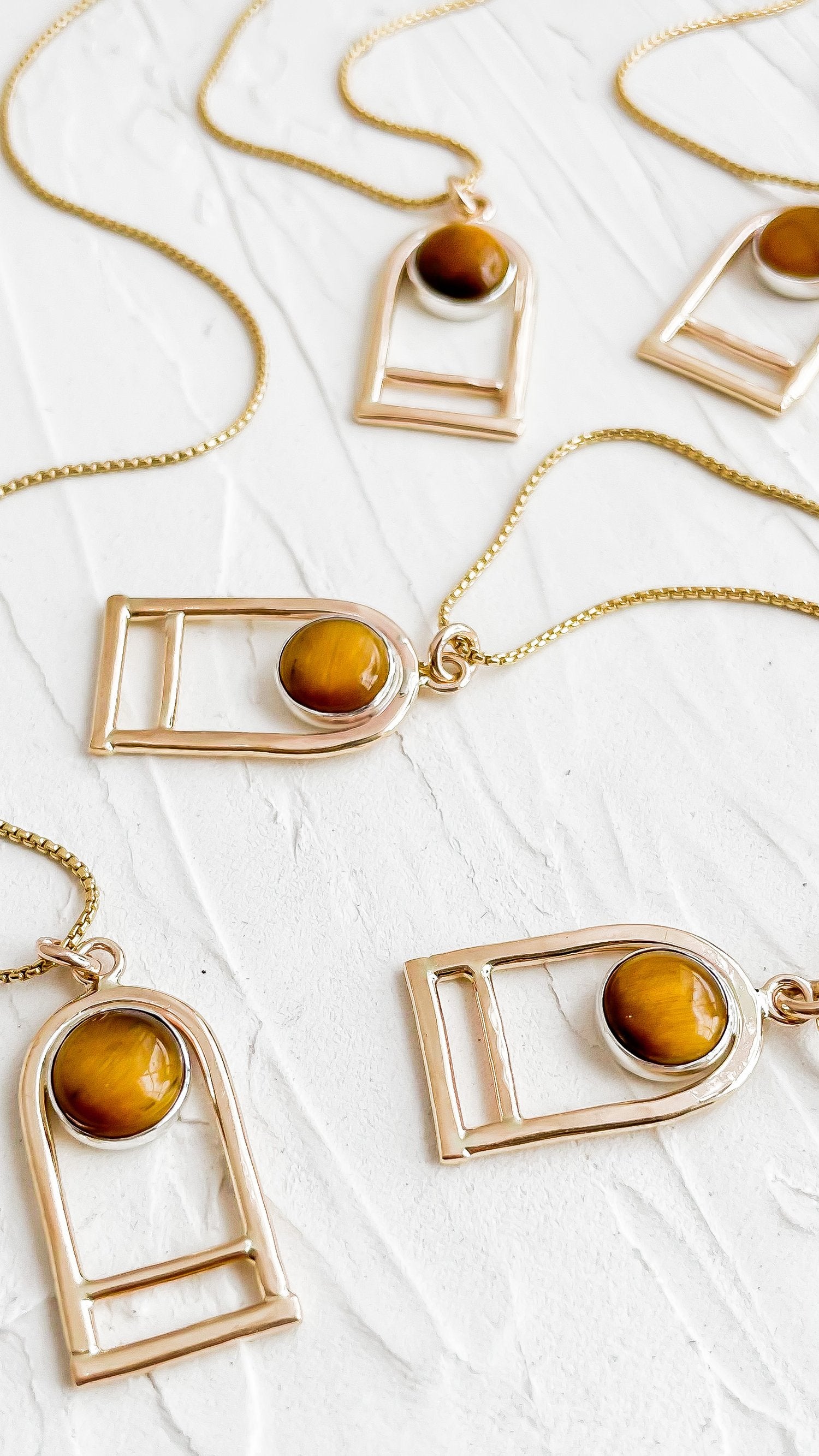 SUN & SELENE tiger's eye arc necklaces