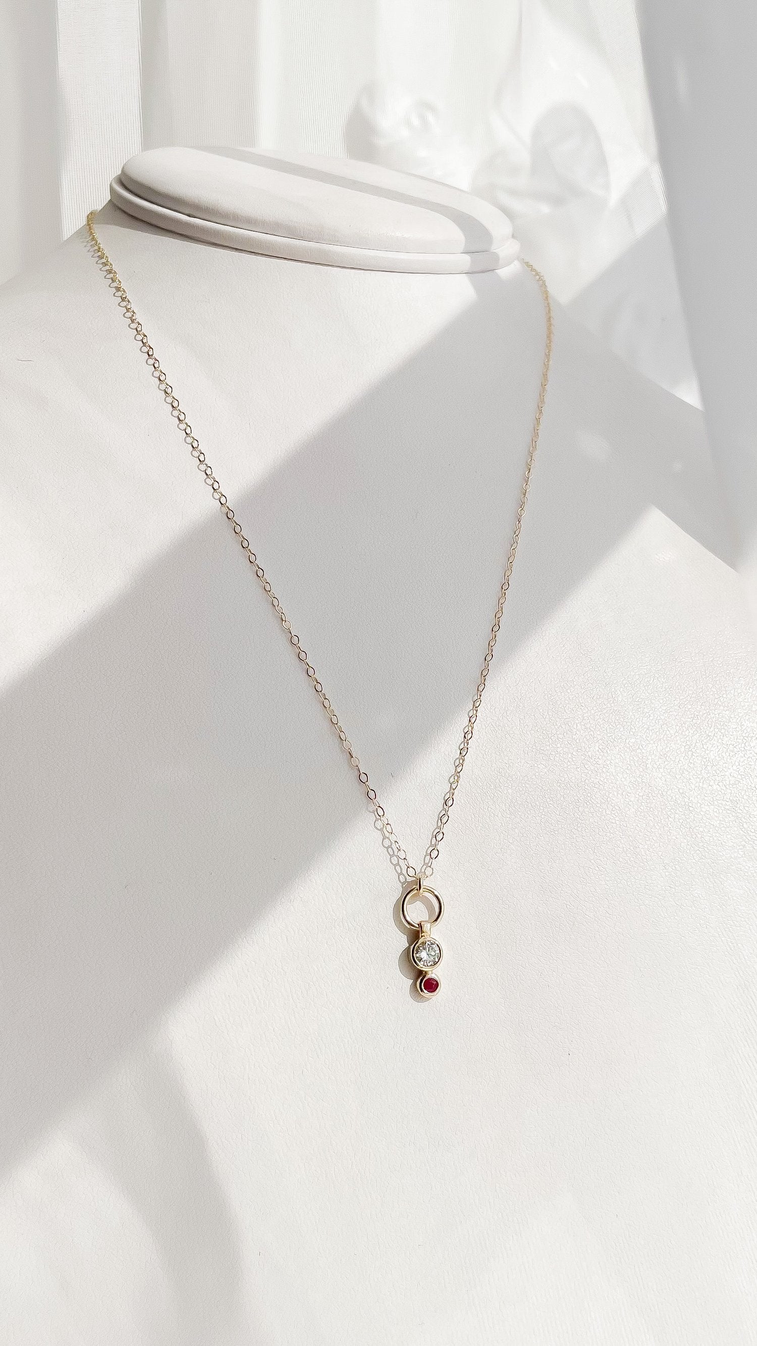 SUN & SELENE ruby and diamond necklace on form