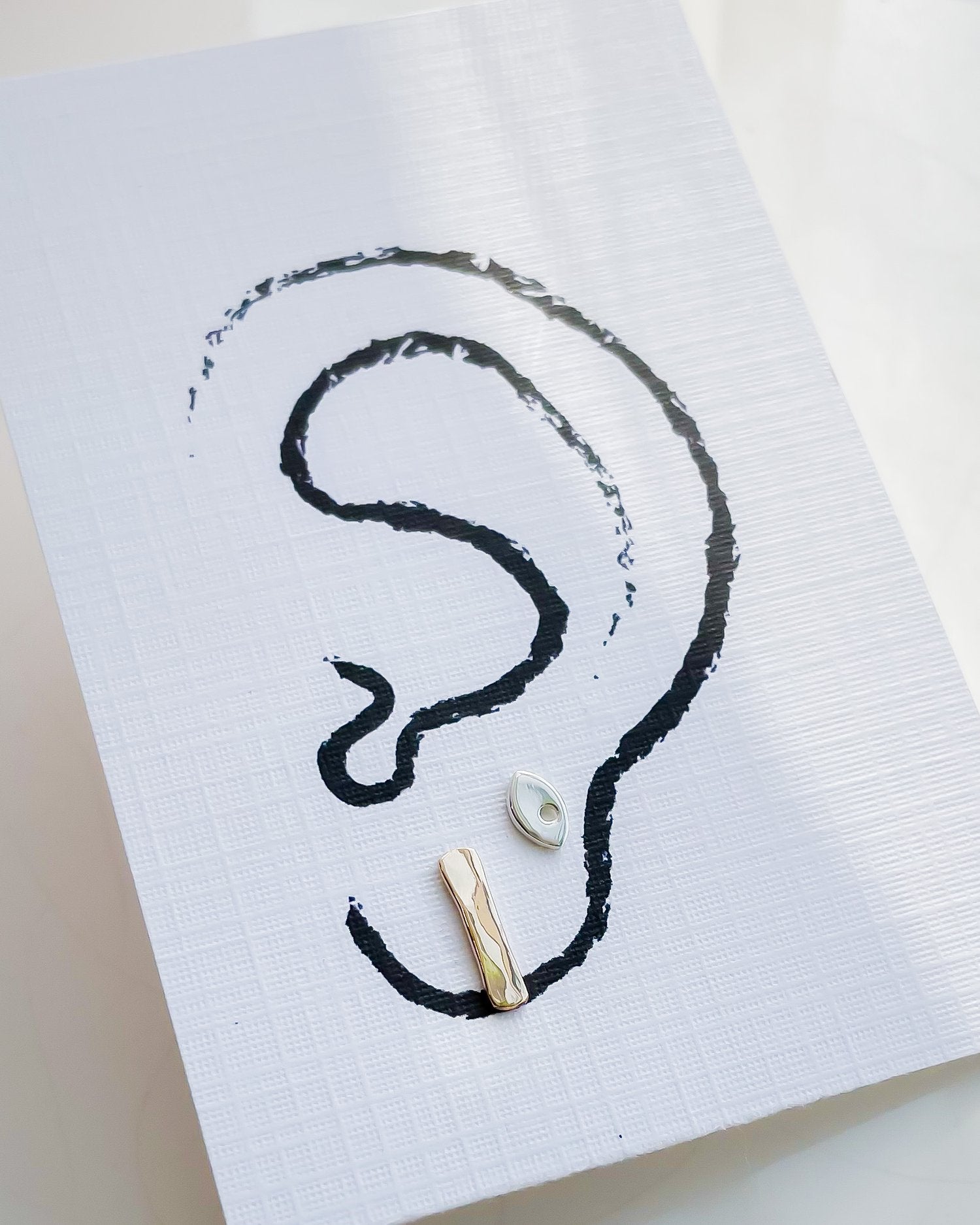 SUN & SELENE earrings on card