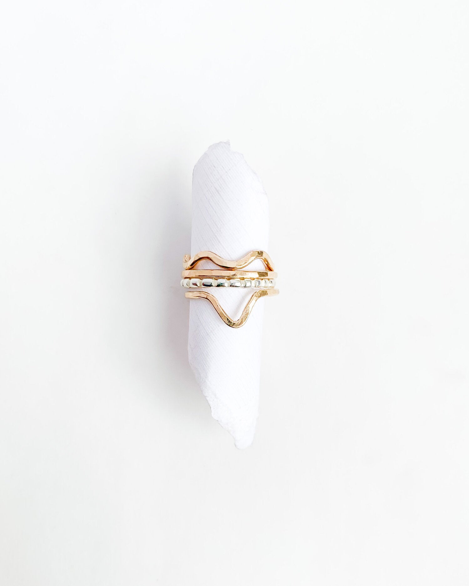 SUN & SELENE handcrafted rings on form 